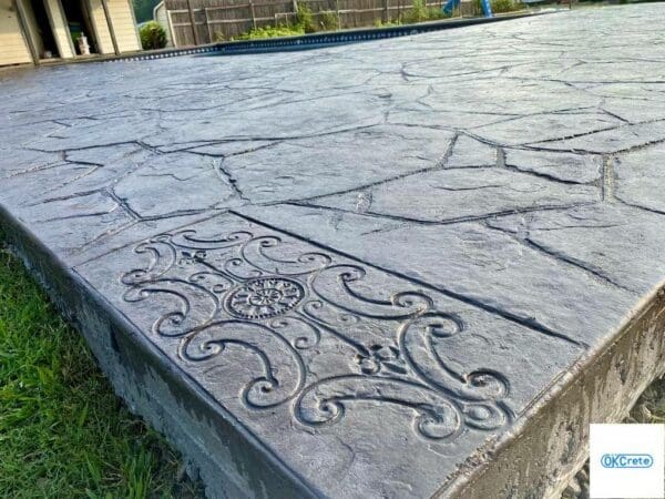 Colored stamped concrete pool deck and patio